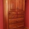 natural walnut armoire with shelving behind doors and full extension drawers