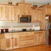 Staggered height hickory cabinets with microwave incorporated