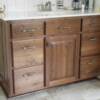 Natural walnut vanity with raised panel ends